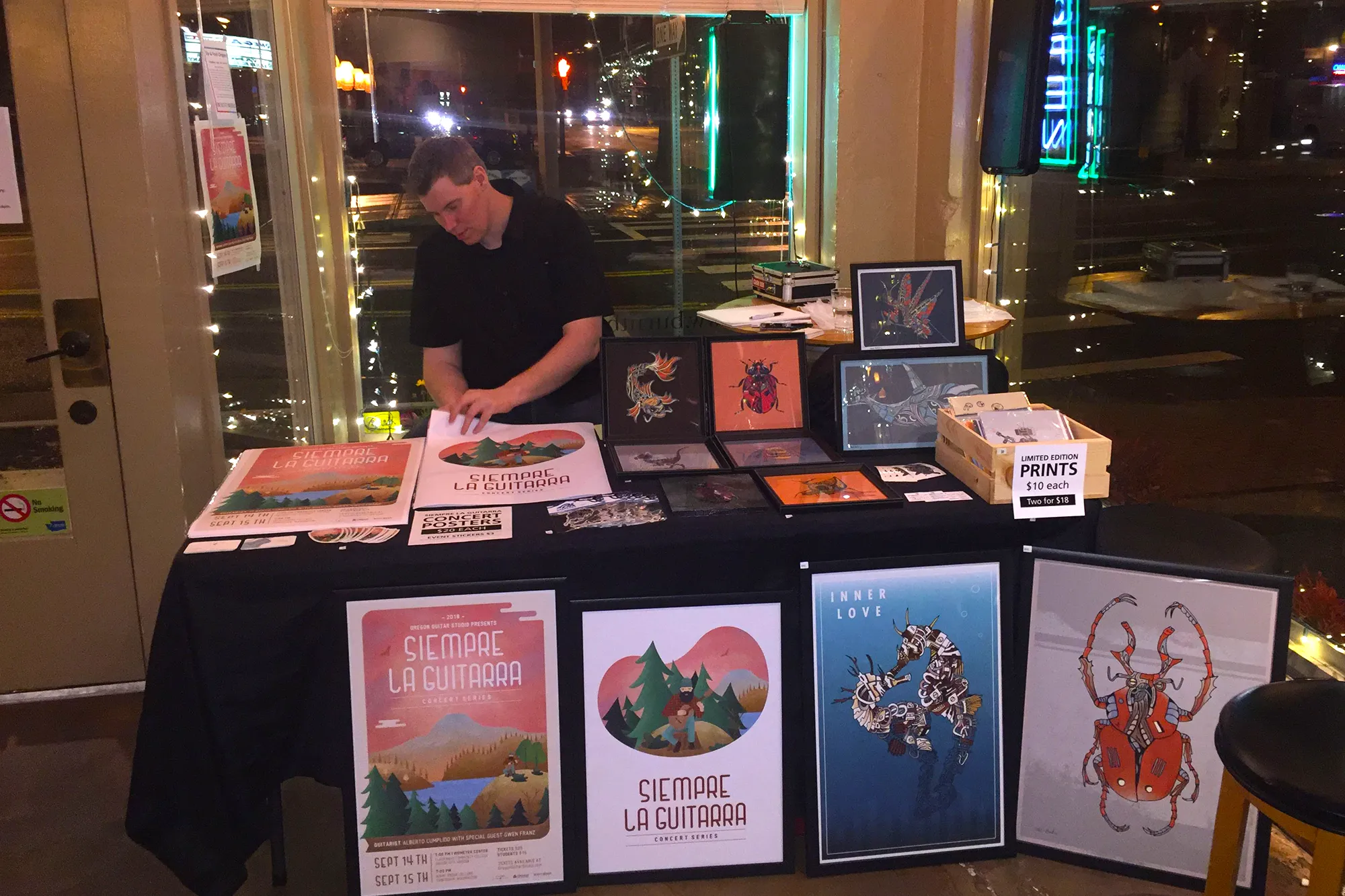Siempre La Guitarra Merchandise Table with Mark Boehly from Graphicsbyte